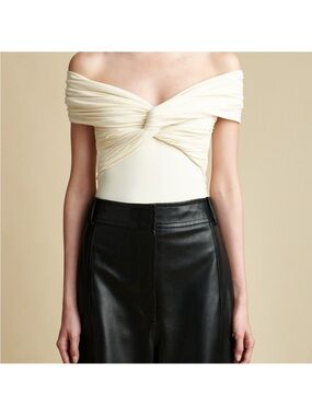 KHAITE Off-Shoulder Twist Bodysuit in Cream